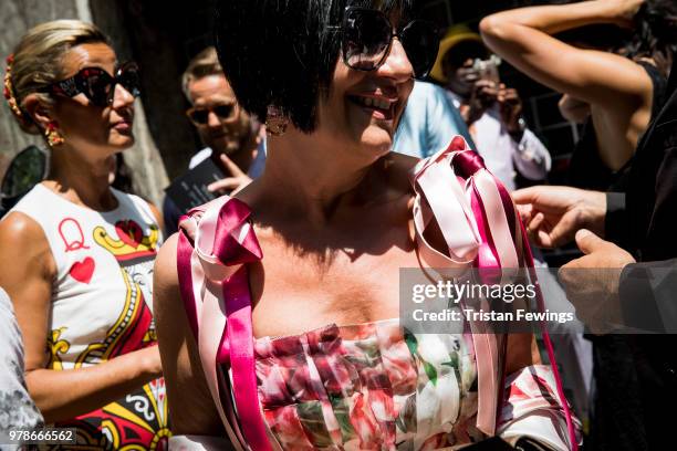 People wait to get into the Dolce & Gabbana show during Milan Men's Fashion Week Spring/Summer 2019 on June 16, 2018 in Milan, Italy.