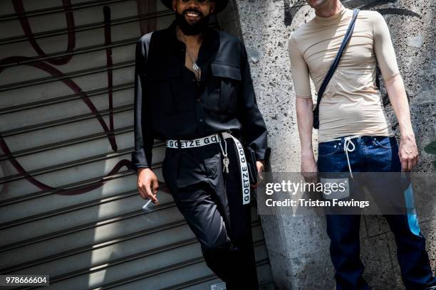 People wait outside the Dolce & Gabbana show during Milan Men's Fashion Week Spring/Summer 2019 on June 16, 2018 in Milan, Italy.