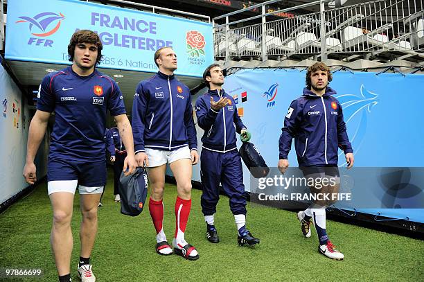 France's left wing Alexis Palisson, flanker Julien Bonnaire, scrum-half Morgan Parra and winger Marc Andreu arrive for a training session on March...