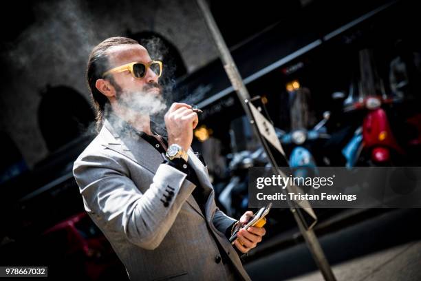 Man is seen outside the Dolce & Gabbana show during Milan Men's Fashion Week Spring/Summer 2019 on June 16, 2018 in Milan, Italy.