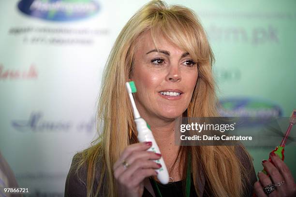 Dina Lohan introduces the "Aqua Freedom Green Lohan Toothbrush" at Pier 92 on March 19, 2010 in New York City.