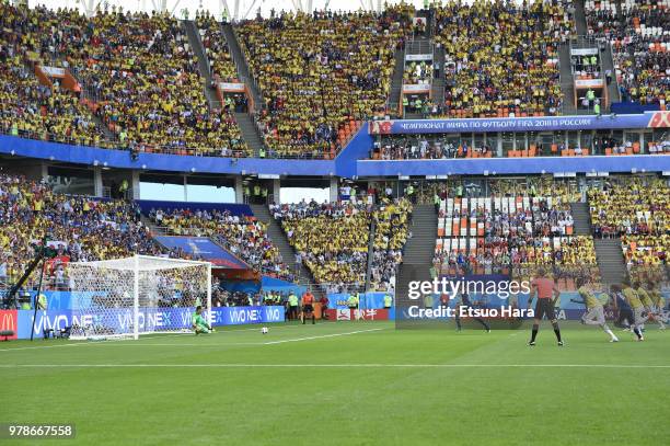 Shinji Kagawa of Japan converts the penalty to score his side's first goal during the 2018 FIFA World Cup Russia group H match between Colombia and...