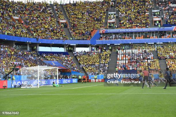 Shinji Kagawa of Japan converts the penalty to score his side's first goal during the 2018 FIFA World Cup Russia group H match between Colombia and...