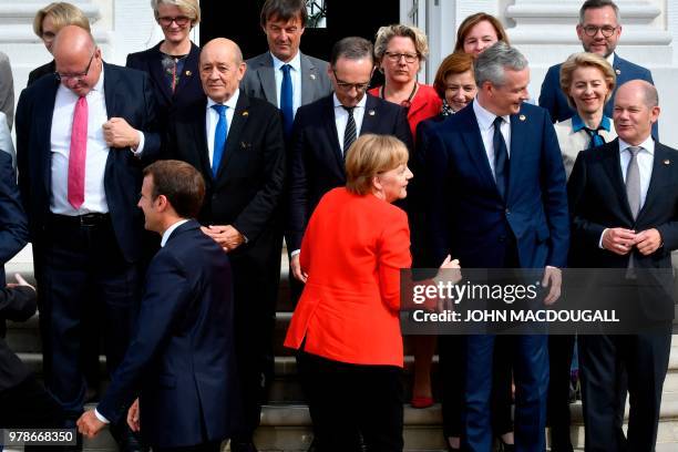 Chancellor Angela Merkel , French President Emmanuel Macron , French Economy Minister Bruno Le Maire , French Foreign Affairs Minister Jean-Yves Le...