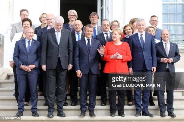 Chancellor Angela Merkel and French President Emmanuel Macron pose with their Ministers, including French Interior Minister Gerard Collomb , Interior...