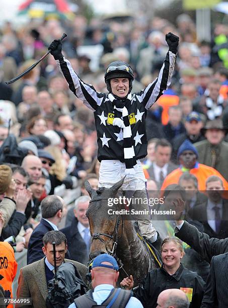 Paddy Brennan riding Imperial Commander celebrates winning the Gold Cup at the Cheltenham Festival on March 19, 2010 in Cheltenham, England.