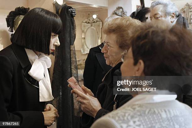 La reine de la lingerie Chantal Thomass, brocanteuse chic aux Puces de Saint-Ouen". French designer Chantal Thomass talks with visitors on March 19,...