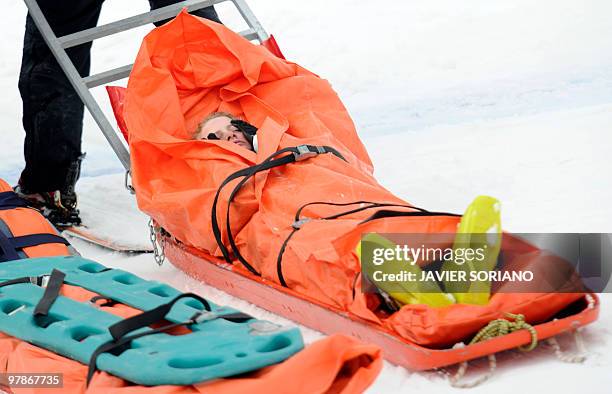 Switzerland's Fanny Smith is carried away on a stretcher after a fall during the women's Freestyle Ski Cross World Cup at Sierra Nevada Ski resort in...