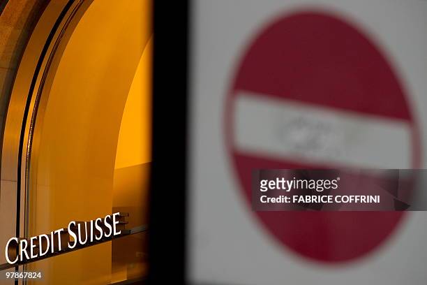 Stop traffic sign is pictured in front of a branch of the Swiss bank Credit Suisse on March 19, 2010 in Lausanne. Over 1,000 rich Germans with...