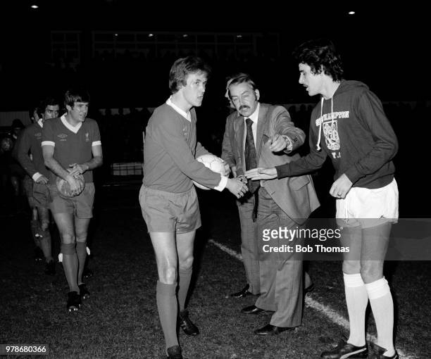 John Gregory of Northampton Town shakes hands with former teammate Phil Neal of Liverpool after the Dave Bowen Testimonial Match at the County Ground...