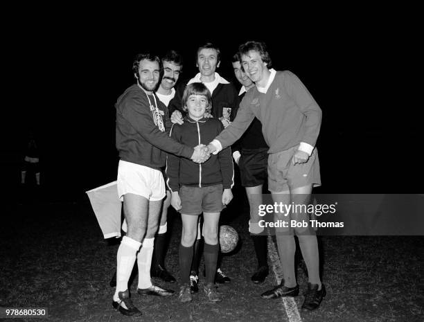 Billy Best of Northampton Town shakes hands with former teammate Phil Neal of Liverpool before the Dave Bowen Testimonial Match at the County Ground...