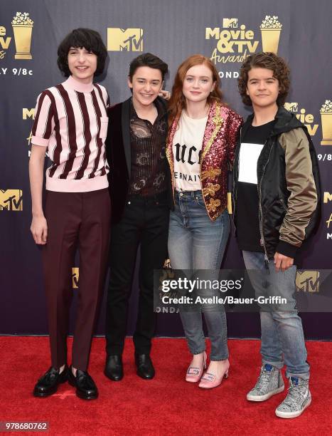 Actors Finn Wolfhard, Noah Schnapp, Sadie Sink and Gaten Matarazzo attend the 2018 MTV Movie And TV Awards at Barker Hangar on June 16, 2018 in Santa...