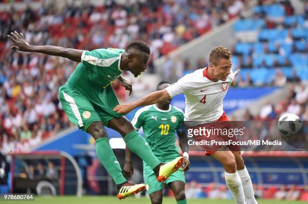 Mame Diouf of Senegal competes with Thiago Cionek of Poland during the 2018 FIFA World Cup Russia group H match between Poland and Senegal at Spartak...