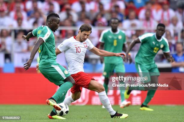 Mame Diouf of Senegal competes with Grzegorz Krychowiak of Poland during the 2018 FIFA World Cup Russia group H match between Poland and Senegal at...