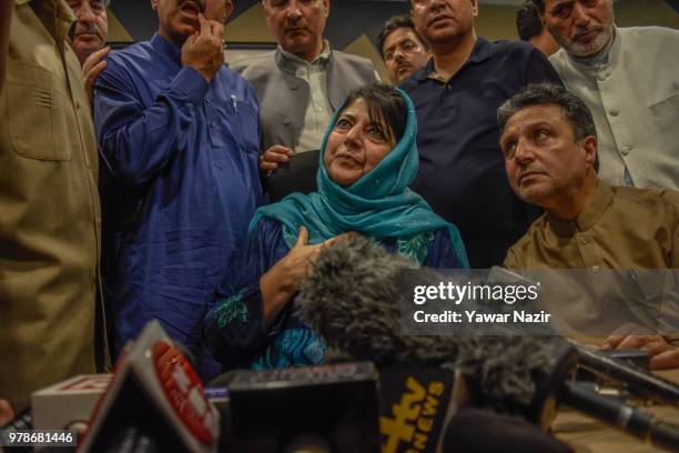 Mehbooba Mufti, patron of the People's Democratic Party , and her cabinet addresses media persons after The ruling Bharatiya Janata Party ended its...