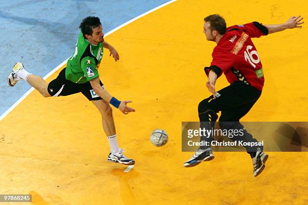 Mark Bult of Berlin scores against Matthias Puhle of Duesseldorf during the Toyota Handball Bundesliga match between HSG Duesseldorf and Fuechse...