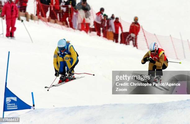 Anna Holmlund of Sweden takes 1st place, Ophelie David of France takes 2nd place during the FIS Freestyle World Cup Women's Ski Cross on March 20,...