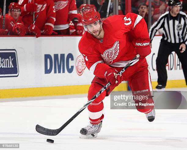 Patrick Eaves of the Detroit Red Wings skates up ice with the puck during an NHL game against the Minnesota Wild at Joe Louis Arena on March 11, 2010...