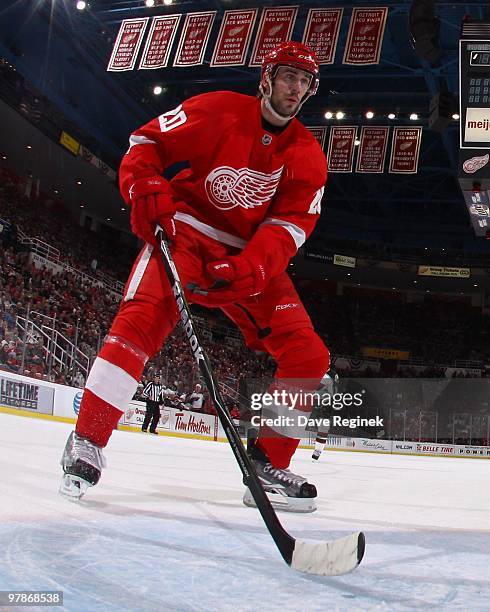 Drew Miller of the Detroit Red Wings skates in front of the net during an NHL game against the Minnesota Wild at Joe Louis Arena on March 11, 2010 in...