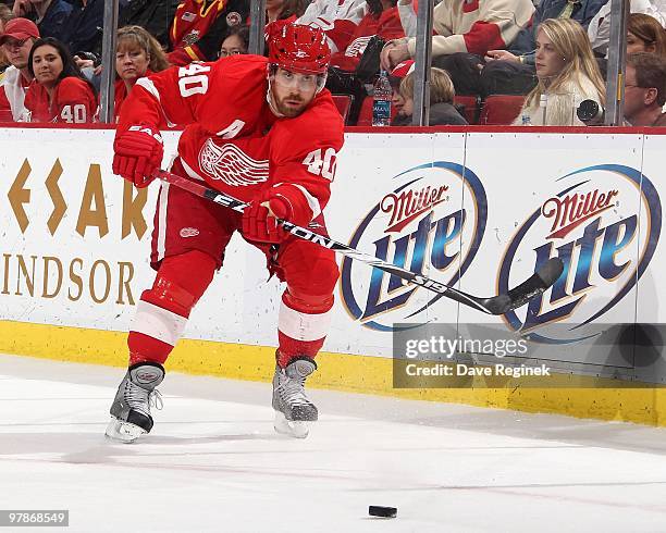 Henrik Zetterberg of the Detroit Red Wings makes a pass during an NHL game against the Minnesota Wild at Joe Louis Arena on March 11, 2010 in...