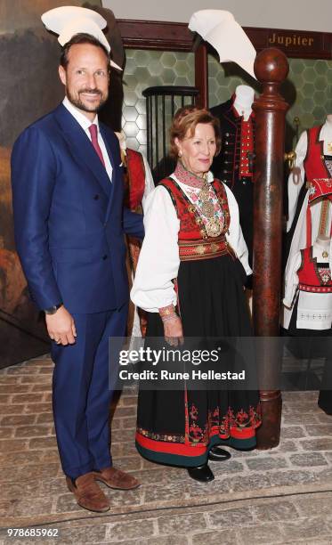 Queen Sonja and Crown Prince Haakon are seen during the opening of the exhibition 'Tradition And Inspiration. National Heritage In The Royal...