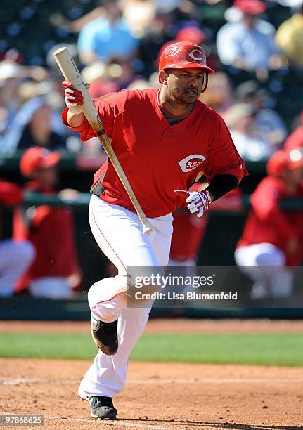 Orlando Cabrera of the Cincinnati Reds runs to first base during a Spring Training game against the Milwaukee Brewers on March 11, 2010 at Goodyear...