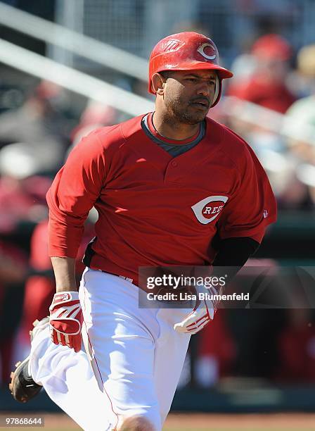 Orlando Cabrera of the Cincinnati Reds runs to first base during a Spring Training game against the Milwaukee Brewers on March 11, 2010 at Goodyear...