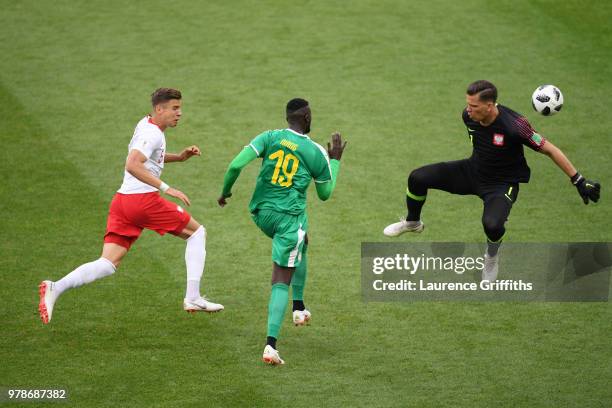 Mbaye Niang of Senegal goes past Jan Bednarek and Wojciech Szczesny of Poland to score the 2nd Senegal goal during the 2018 FIFA World Cup Russia...