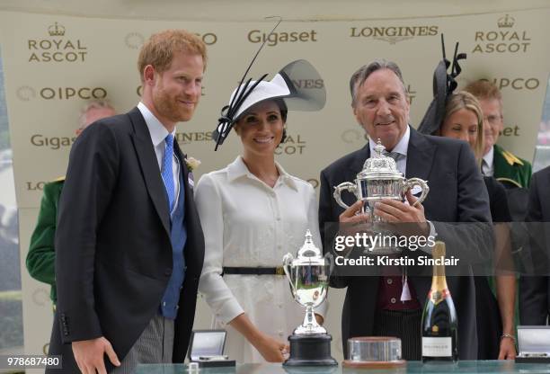 Prince Harry, Duke of Sussex and Meghan, Duchess of Sussex present the winners cup to breeder John Gunther after his horse Without Parole ridden by...