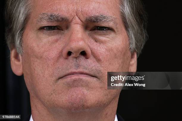 Former Senate Intelligence Committee Security Director James Wolfe listens as his attorney Benjamin Klubes makes a statement to members of the media...