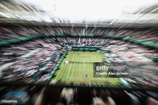 Roger Federer of Switzerland returns the ball to Aljaz Bedene of Slovenia during their first round match on day 2 of the Gerry Weber Open at Gerry...