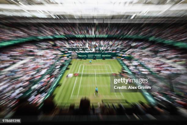 Roger Federer of Switzerland returns the ball to Aljaz Bedene of Slovenia during their first round match on day 2 of the Gerry Weber Open at Gerry...