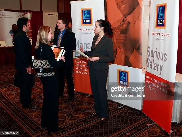 Job seeker Kristina Chmura, front left, interviews with Kimberly Guifoyle, district manager of Aldi Inc. At at Eastern Michigan University's...