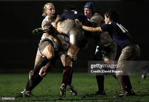 Marie-Charlotte Hebel of France is wrapped up by the English defence during the Women's Six Nations match between France and England at the Stade...