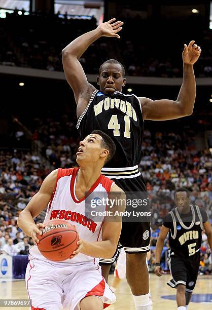 Ryan Evans of the Wisconsin Badgers gets Tim Johnson of the Wofford Terriers up in the air during the first round of the 2010 NCAA men's basketball...