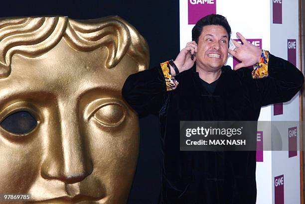 British comedian Dom Joly arrives at the British Academy Games Awards 2010 in Central London on March 19, 2010. AFP PHOTO/MAX NASH