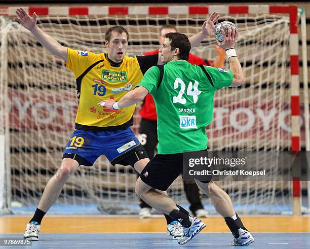 Max Weiss of Duesseldorf defends against Bartlomiej Jaszka of Berlin during the Toyota Handball Bundesliga match between HSG Duesseldorf and Fuechse...