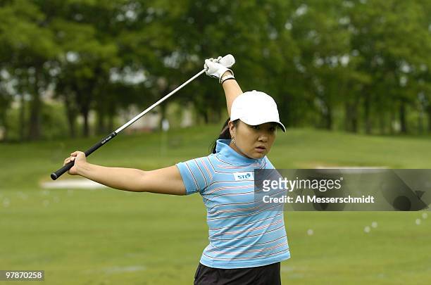 Jeong Jang stretches at the driving range April 29 in the rain-delayed second round of the 2005 Franklin American Mortgage Championship in Franklin,...