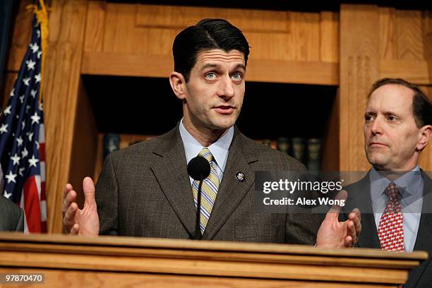 Rep. Paul Ryan speaks as Rep. Dave Camp looks on during a news conference on the health care legislation March 19, 2010 on Capitol Hill in...