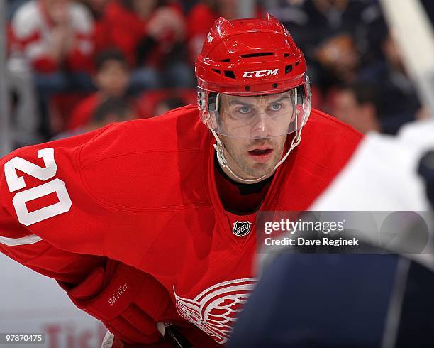 Drew Miller of the Detroit Red Wings gets set for the face-off during an NHL game against the Buffalo Sabres at Joe Louis Arena on March 13, 2010 in...