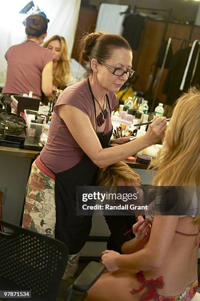 Swimsuit Issue 2010: Wife of USA soccer player Clint Dempsey, Bethany Dempsey is photographed with body painting artist Joanne Gair behind the scenes...