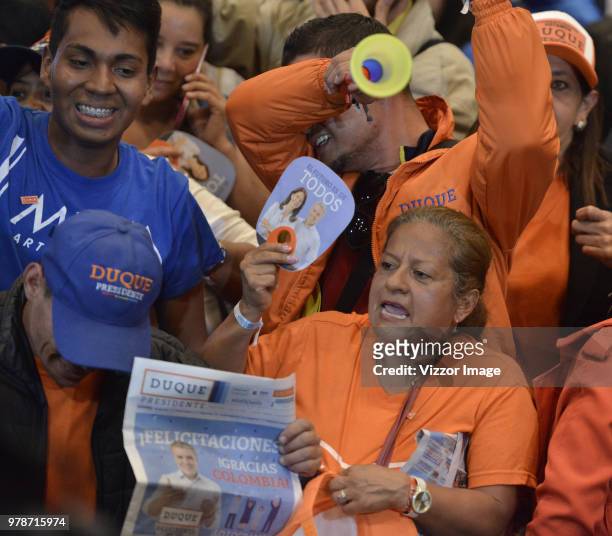 Followers of Ivan Duque, elected president of Colombia for the Centro Democratico party, celebrate after the presidential ballotage between...