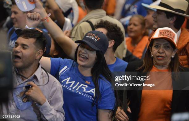 Followers of Ivan Duque, elected president of Colombia for the Centro Democratico party, celebrate after the presidential ballotage between...