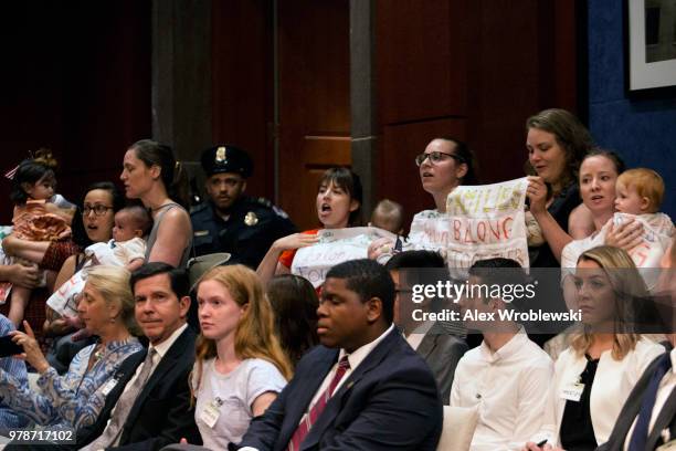 Protesters chant "families belong together" at a hearing with Inspector General Michael Horowitz on June 19, 2018 in Washington, DC. The Inspector...