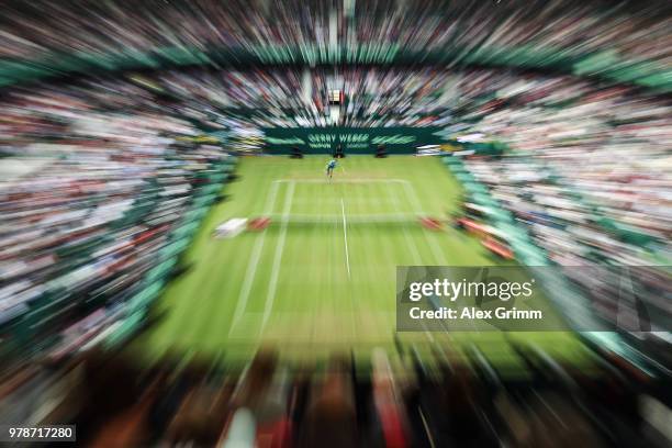 Roger Federer of Switzerland serves the ball to Aljaz Bedene of Slovenia during their first round match on day 2 of the Gerry Weber Open at Gerry...