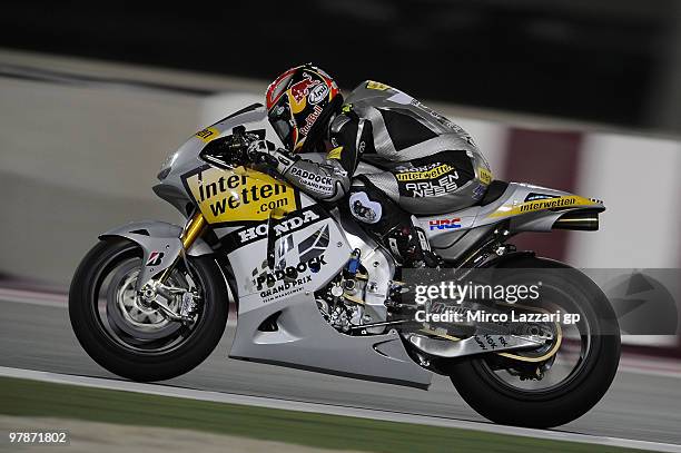 Hiroshi Aoyama of Japan and Interwetten MotoGP Team heads down a straight during the third day of testing at Losail Circuit on March 19, 2010 in...