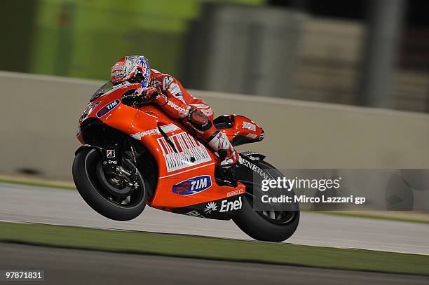 Casey Stoner of Australia and Ducati Marlboro Team lifts the front wheel during the third day of testing at Losail Circuit on March 19, 2010 in Doha,...