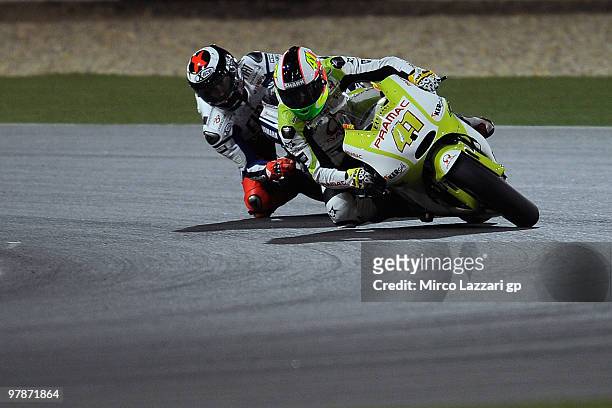 Aleix Espargaro of Spain and Pramac Green Energy Team leads Jorge Lorenzo of Spain and Fiat Yamaha Team during the third day of testing at Losail...