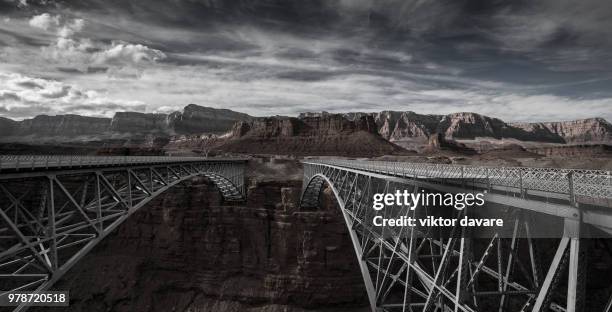 silver navajo bridge over colorado river in marble canyon, arizona, usa - marble canyon foto e immagini stock