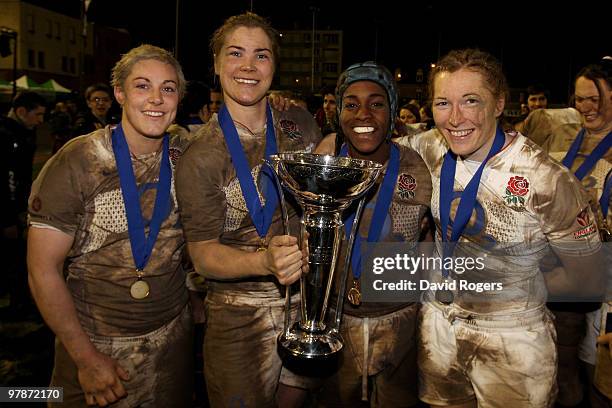 England back rowers Heather Fisher, Catherine Spencer, Margaret Alphonsi and Karen Jones of England celebrate with the trophy after they won the...